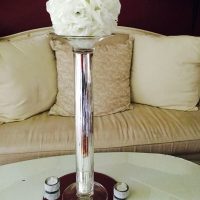 White floral ball table centrepiece with white candles