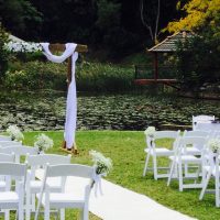 White Chairs and Aisle Flowers