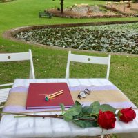 Signing Table with cover and red roses