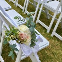 White Chairs with Flower Decor