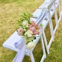 White Chairs with Flower Decor