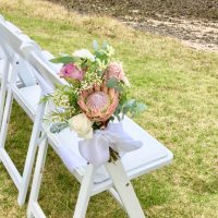 White Chairs with Flower Decor